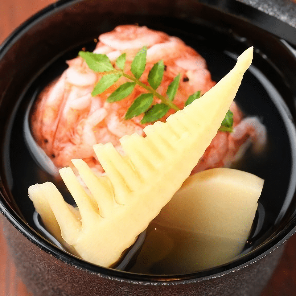 Steamed shrimp dumpling and bamboo shoots in broth.